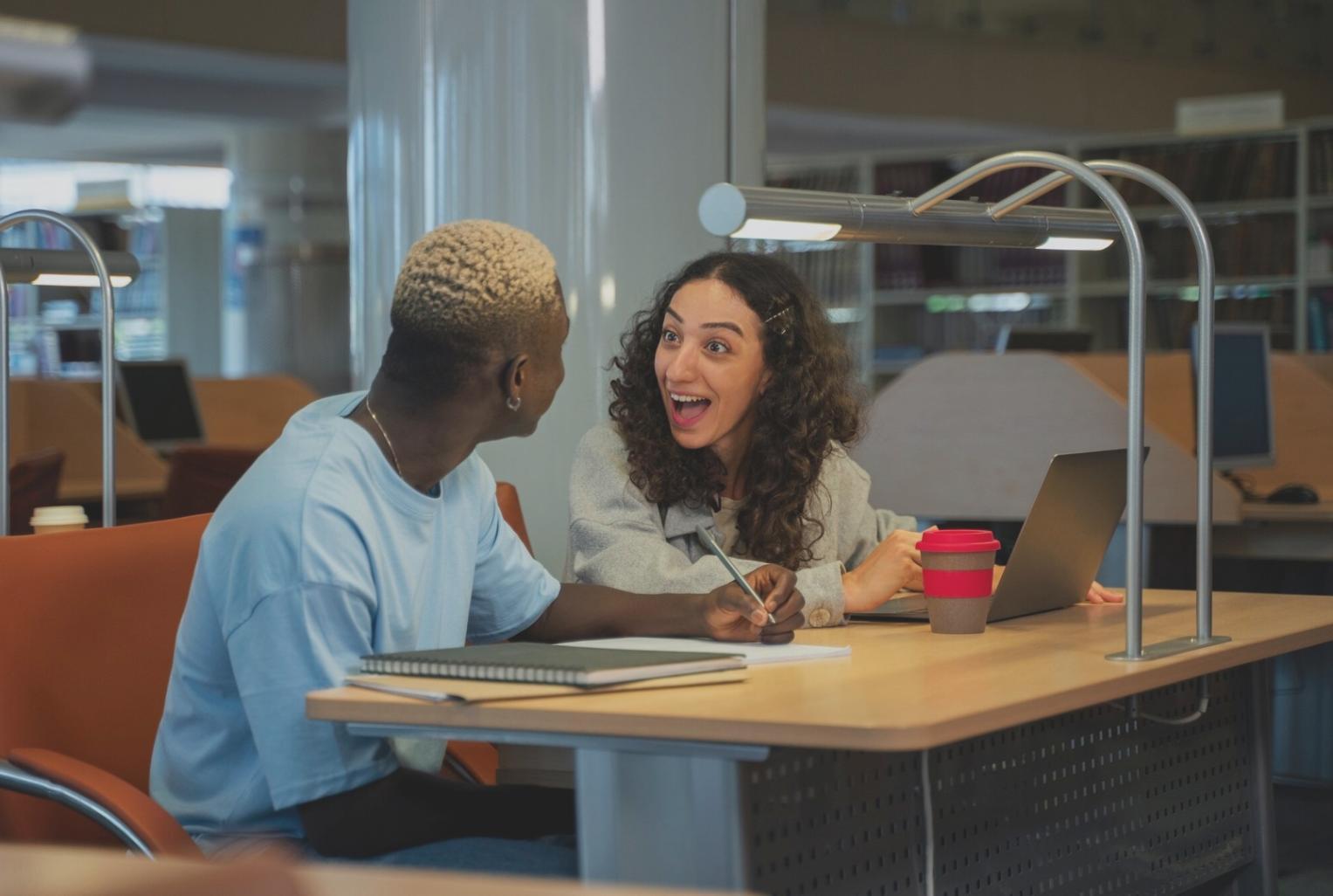 Insurance advisor reviewing policy documents with client in office setting